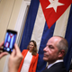 People pose for photographs at reopening of Cuban embassy. Photo: Getty